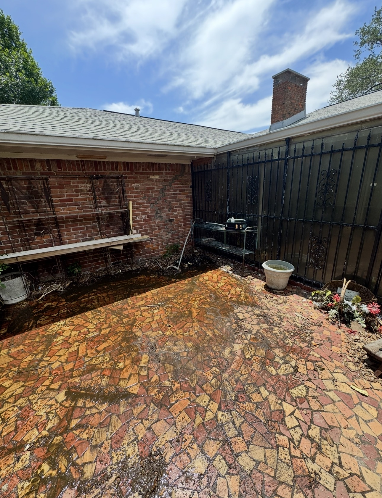 Clean tile patio after an old hot tub was demolished and hauled away in Houston, TX